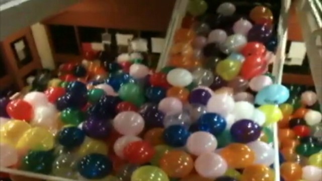 VIDEO:  May, 2012: Seniors at a Massachusetts high school used 3,300 balloons to fill a school staircase.