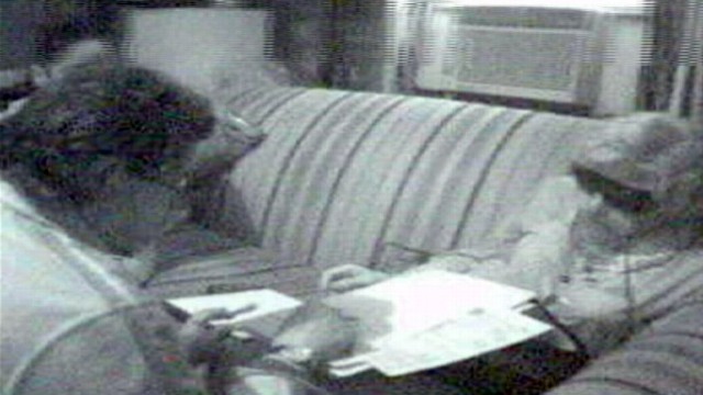 VIDEO: Footage from authorities shows man in wig, dress in meeting with investigators.