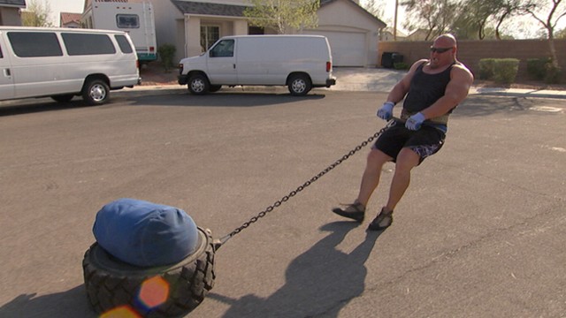 VIDEO: Strongman Demonstrates Sandbag-Tire Pull