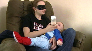 PHOTO Chrissy Steltz feeds her son a bottle. Years after a shotgun accident, Steltz fell in love.