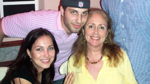 PHOTO Grace Carricarte celebrates with her children, Brian and Grace, at her 50th birthday party
