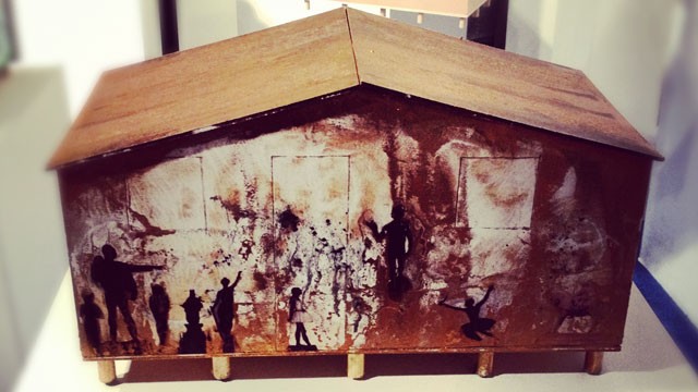 A small-scale replica of a house intervened by the Cuban artist Glexis Novoa for the non-profit organization "Techo". They build houses in areas of extreme poverty in Latin America.
