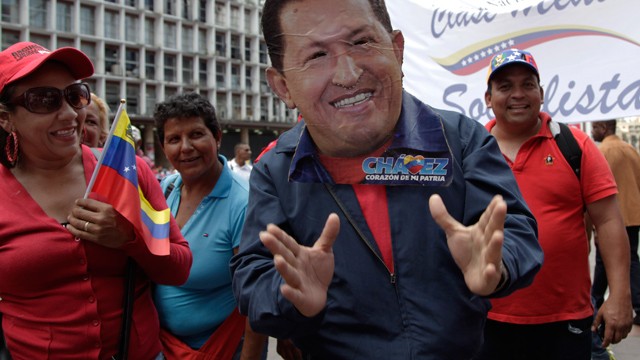 PHOTO: A man wearing a handcrafted mask depicting the face of Venezuela's President Hugo Chavez attends an event commemorating the violent street protests of 1989 known as the 