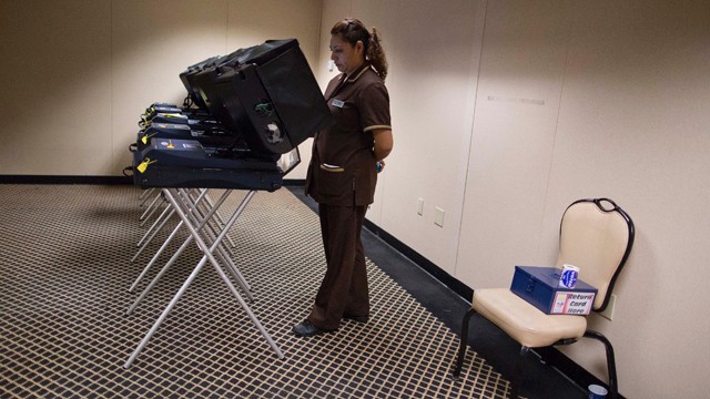 PHOTO: Liliana Perez, casts her ballot at an early voting polling place behind The Mirage Hotel Casino, Saturday, Oct. 20, 2012, in Las Vegas.