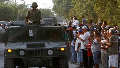 PHOTO: Mexican army soldiers entered the town of La Ruana, Michoacan on Monday, May 20, 2013. Residents of western Mexico towns who endured months besieged by a drug cartel are cheering the arrival of hundreds of Mexican army troops.