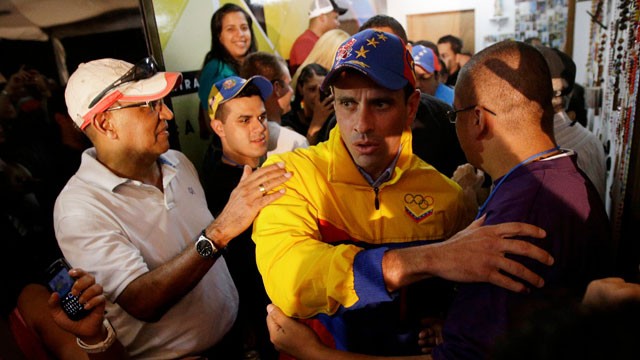 PHOTO:&nbsp;Venezuelan opposition candidate Henrique Capriles greets supporters who congratulate him for his victory in Miranda State on Sunday. Capriles was one of just three opposition candidates who were not defeated by Chavez allies on Sunday.