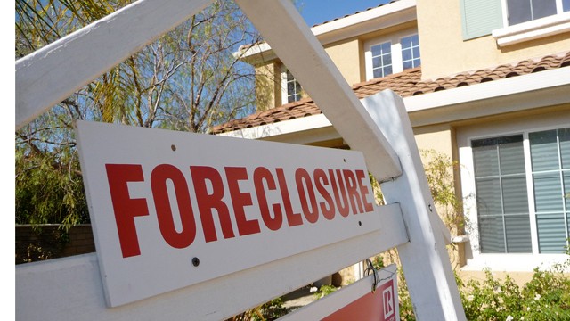 PHOTO: I didn't need to see the sign to know this house was in foreclosure. The front yard was brown, flowers dying. In a neighborhood with prices starting at $700,000 homes, it's very sad.