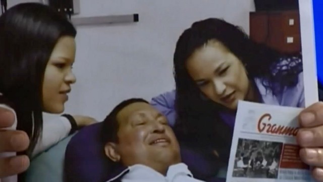 PHOTO: Hugo Chavez smiles in Cuba next to his daughters