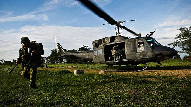 PHOTO:&nbsp;A Colombian soldier lands in a remote area of Colombia&acute;s Meta province, during an operation against the FARC guerrillas.  The Colombian government launches peace talks with the rebel group on Thursday.