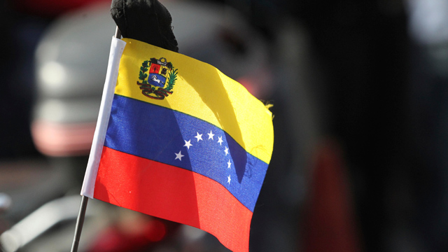 PHOTO: View of a flag during the march of the supporters of President Hugo Chavez through the streets of Caracas to the military academy on March 06, 2013 in Caracas, Venezuela. With Chavez gone a new generation of leaders must emerge in Venezuela.