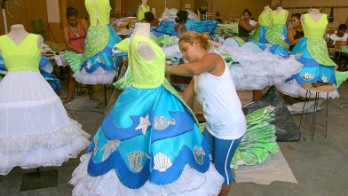 PHOTO: Women put the finishing touches on costumes for the upcoming Carnival