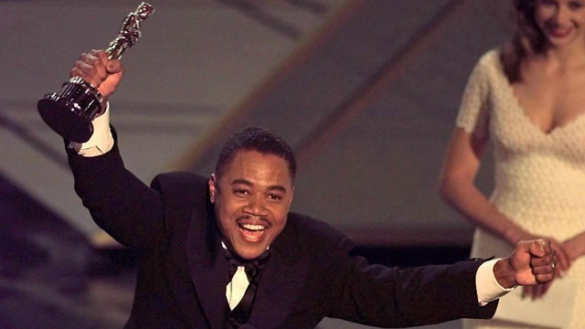 PHOTO:  Actor Cuba Gooding, Jr holds up his Oscar after winning the Best Supporting Actor Award for his role in 'Jerry Maguire' during the 69th Academy Awards