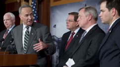 US Senator Chuck Schumer (2nd L), a Democrat from New York, speaks alongside (L-R) John McCain (R-AZ), Robert Menendez (D-NJ),Dick Durbin (D-IL) and Marco Rubio (R-FL)