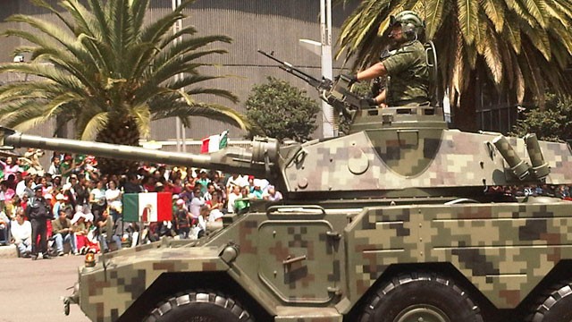 PHOTO: An armed vehicle parades the streets of Mexico City during recent independence day celebrations. Over the past six years the Mexican government has increasingly deployed the military to fight drug gangs around the country.