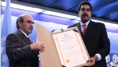 PHOTO: Venezuelan President Nicolas Maduro, poses with FAO director Jose Graziano da Silva. On Sunday, The FAO, aawarded Venezuela a special certificate for reducing hunger by half, despite current food shortages in the South American nation.