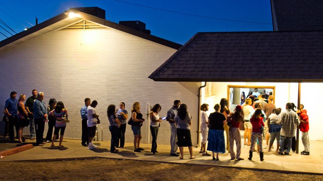 PHOTO: People wait in line to vote at the First New Life Missionary Baptist Church at 19th Ave. and Roeser, Tuesday, Nov. 6, 2012 in Phoenix.