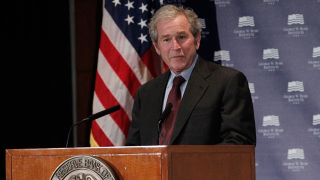 PHOTO: Former President George W. Bush gives opening remarks at the Federal Reserve Bank of Dallas for a conference titled