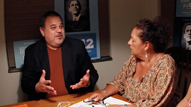 PHOTO: In this Oct. 10, 2012 photo, Frank Nieves, of the Puerto Rican/Hispanic Chamber of Commerce, left, talks to phone bank volunteer Ana Sofia Ballen, of the Hispanics for Obama organization, in Cooper City, Fla. Puerto Ricans and Cubans are the larges