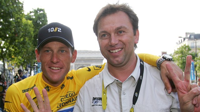 PHOTO:&nbsp;This July 24, 2005 file photo shows Lance Armstrong, left, and Johan Bruyneel, sporting director of the Discovery team, posing on the Champs Elysees during a victory parade after Armstrong won his seventh straight Tour de France cycling race in Par