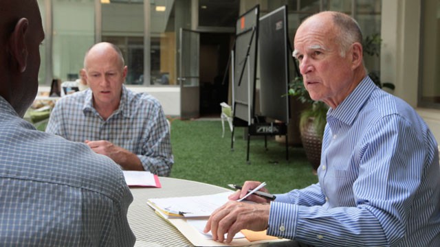 PHOTO: Gov. Jerry Brown, right, discusses a bill with Legislative Affairs Secretary Gareth Elliott