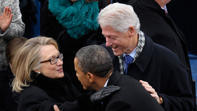 PHOTO: President Barack Obama is greeted by Secretary of State Hillary Clinton and former President Bill Clinton.