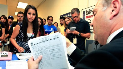 PHOTO: Gaby Perez, left, hands over all her paperwork to get guidance from immigration attorney Jose Penalosa, right, in Phoenix on August 15, 2012, for a new federal program, called Deferred Action, that would help some young undocumented immigrants avoi