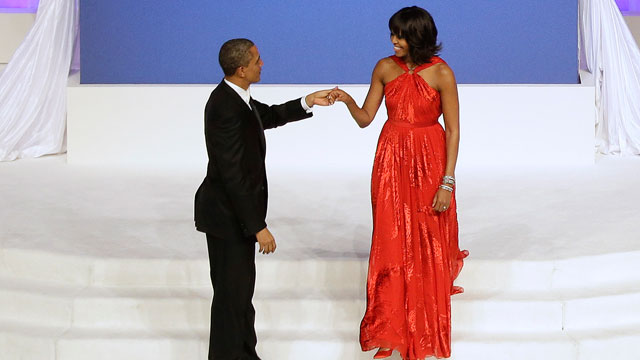 PHOTO: President Barack Obama greets first lady Michelle Obama as she arrives on stage during the Commander-In-Chief Inaugural ball at the Washington Convention Center during the 57th Presidential Inauguration Monday, Jan. 21, 2013 in Washington.