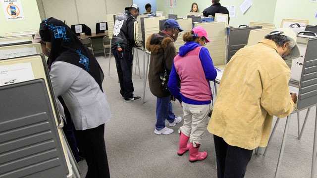 PHOTO: People vote inside the Hamilton County Board of Elections after it opened for early voting, Tuesday, Oct. 2, 2012, in Cincinnati. Ohioans can cast an early ballot by mail or in person beginning Tuesday for the Nov. 6 election.