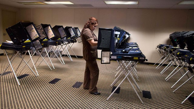 PHOTO: A woman who works in the housekeeping department of a Las Vegas Strip casino casts her ballot at an early voting polling placce, Saturday, Oct. 20, 2012, in Las Vegas.