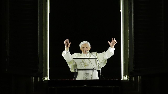 PHOTO: Pope Benedict XVI blesses the faithful gathered for a candlelight procession.