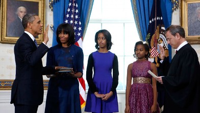 PHOTO: President Barack O bama is officially sworn-in by Chief Justice John Roberts in the Blue Room of the White House during the 57th Presidential Inauguration in Washington, Sunday, Jan. 20, 2013.