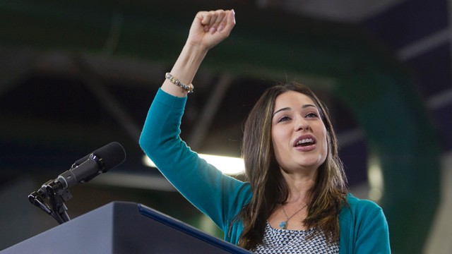 PHOTO:&nbsp;In this Aug. 22, 2012 photo, President Barack Obama is introduced by Clark County, Nev. teacher Claritssa Sanchez during a rally at Canyon Springs High School in North Las Vegas.