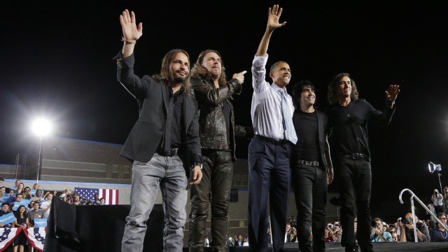 PHOTO: President Barack Obama, center, on stage with members of the Mexican Rock Band Mana, during a campaign event in Desert Pines High School, Sunday, Sept. 30, 2012 in Las Vegas.