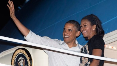President Barack Obama and first lady Michelle Obama board Air Force One at Honolulu Joint Base Pearl Harbor-Hickam, Saturday, Jan. 5, 2013, in Honolulu, en route to Washington after their holiday vacation.