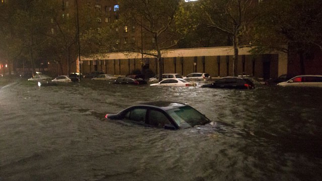 PHOTO: This combination of photos shows above, lower Manhattan dark after the hybrid storm Sandy on Monday, Oct. 29, 2012, and below a fully lit skyline on Jan. 6, 2012