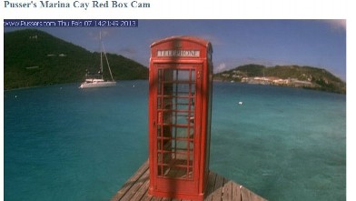 PHOTO: Tourists are puzzled by the phone booth on the sea