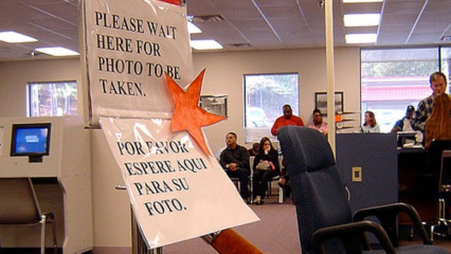 PHOTO: A sign tells people at a Division of Motor Vehicles office where to stand.