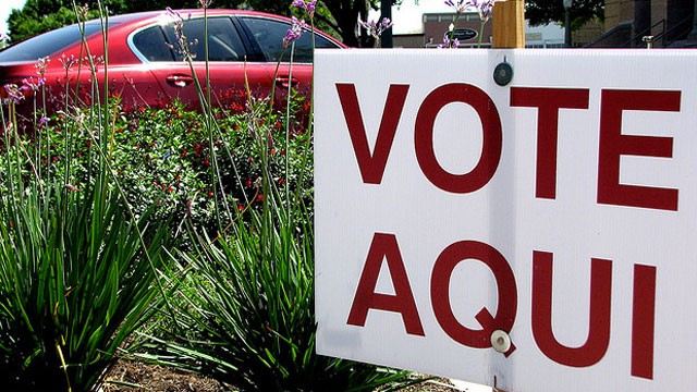 PHOTO: A Spanish-language sign tells voters where to cast their ballots.