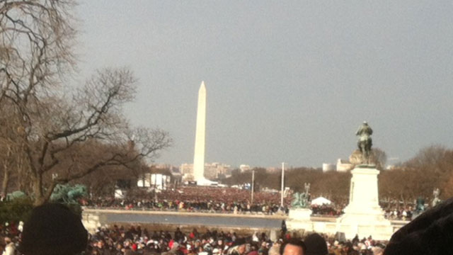 PHOTO: Crowds of people fill the Mall, all the way to the Washington Monument.