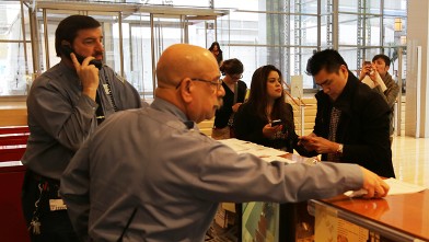 PHOTO: Jose Antonio Vargas and Mónica Novoa of Define American deliver two cardboard boxes to the New York Times, which they say contain a petition with over 70,000 signatures asking the media company to drop the term 