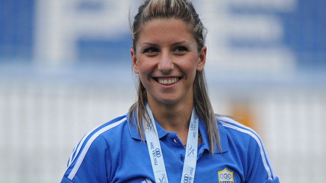 Bronze medalist Paraskevi Papachristou of Greece poses for the photographers after the Women's Triple Jump Final during the XVI Mediterranean Games in Italy.