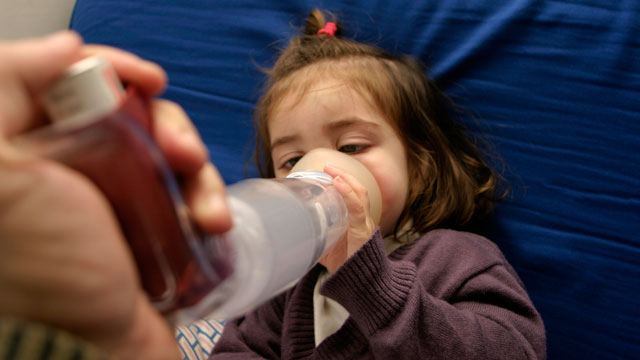 PHOTO: A young girl receives treatment for asthma. Health officials say ailments like asthma are linked to climate change.
