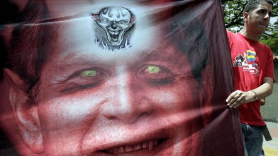 PHOTO: Anti-US protesters show a rather unflattering depiction of former Pres. Bush