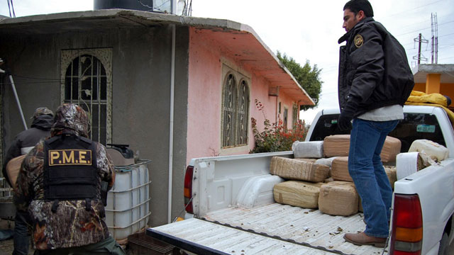 PHOTO: Policemen unload packages of confiscated marijuana in Nuevo Laredo, Tamaulipas state, Mexico.