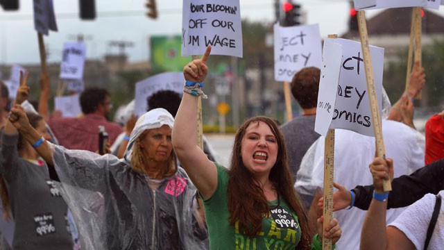 PHOTO:&nbsp;Protesters demonstrate in front of the Bain Capital owned Bloomin' Brand Corporate Headquarters before the start of the Republican National Convention at the Tampa Bay Times Forum on August 27, 2012 in Tampa, Florida.