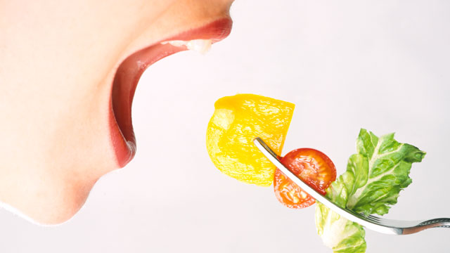 PHOTO:  Woman Eating Vegetables