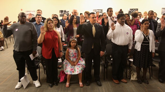 PHOTO:&nbsp;Immigrants take the oath of citizenship at a special Valentine's Day naturalization ceremony for married couples on February 14, 2013 in Tampa, Florida.