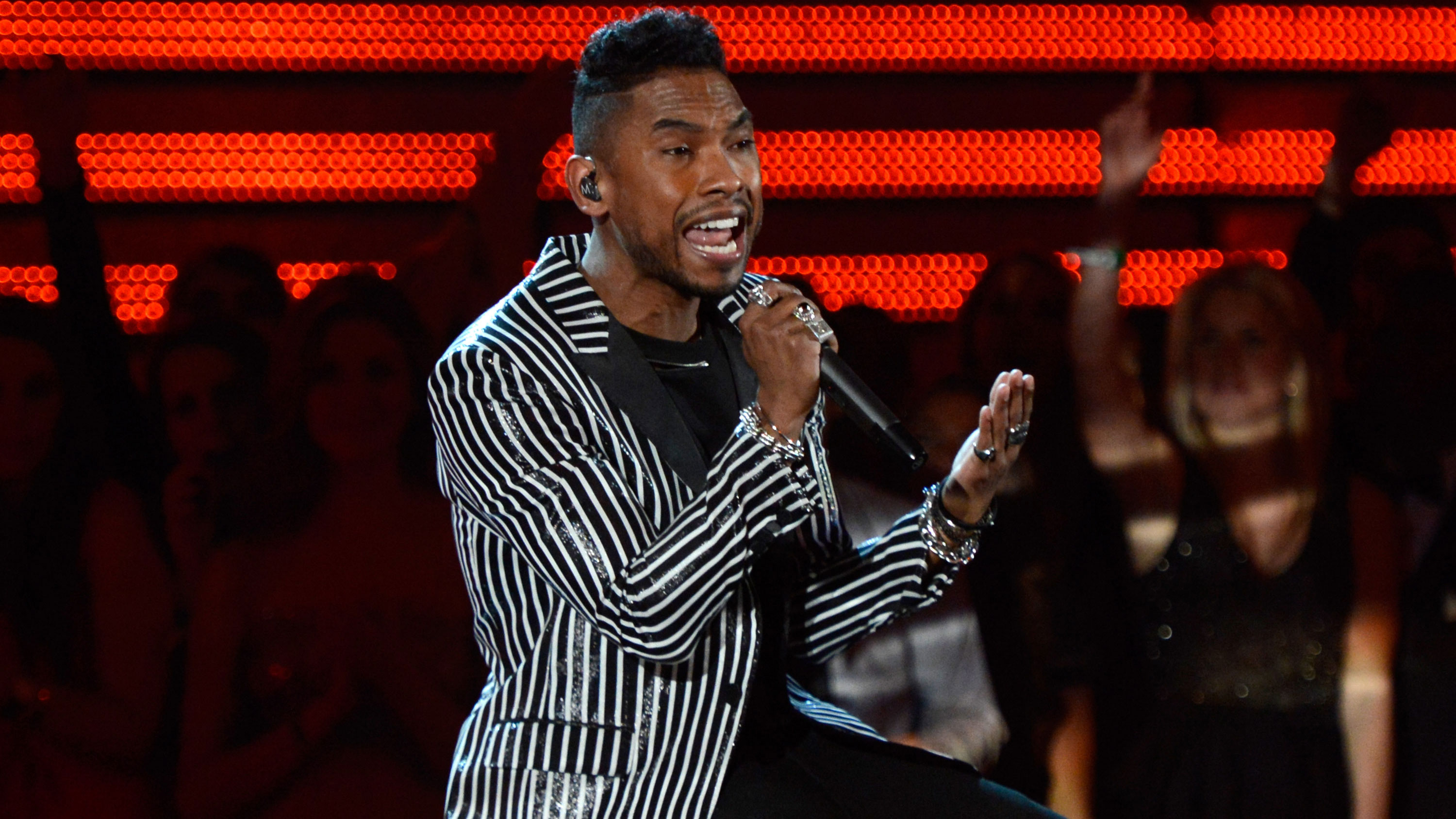 PHOTO: Miguel's jacket is both weird and totally working for him.