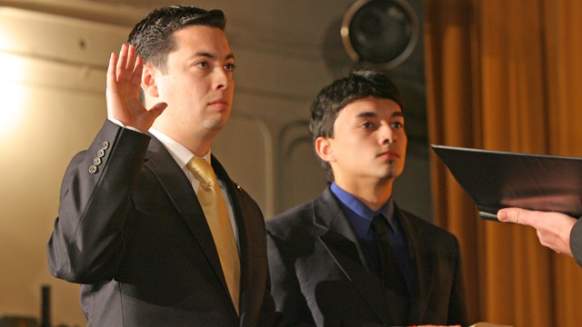 PHOTO: Central Falls, RI -- Tues., Jan. 1, 2013 James Diossa, first Hispanic mayor in Central Falls history, is inaugurated in Central Falls High School. The mayor's brother, Michael, stands with him.