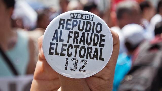 PHOTO:A protester holds a button during election fraud march in Mexico City on July 7, 2012.